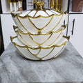 Ceramic serving bowl with gold rim