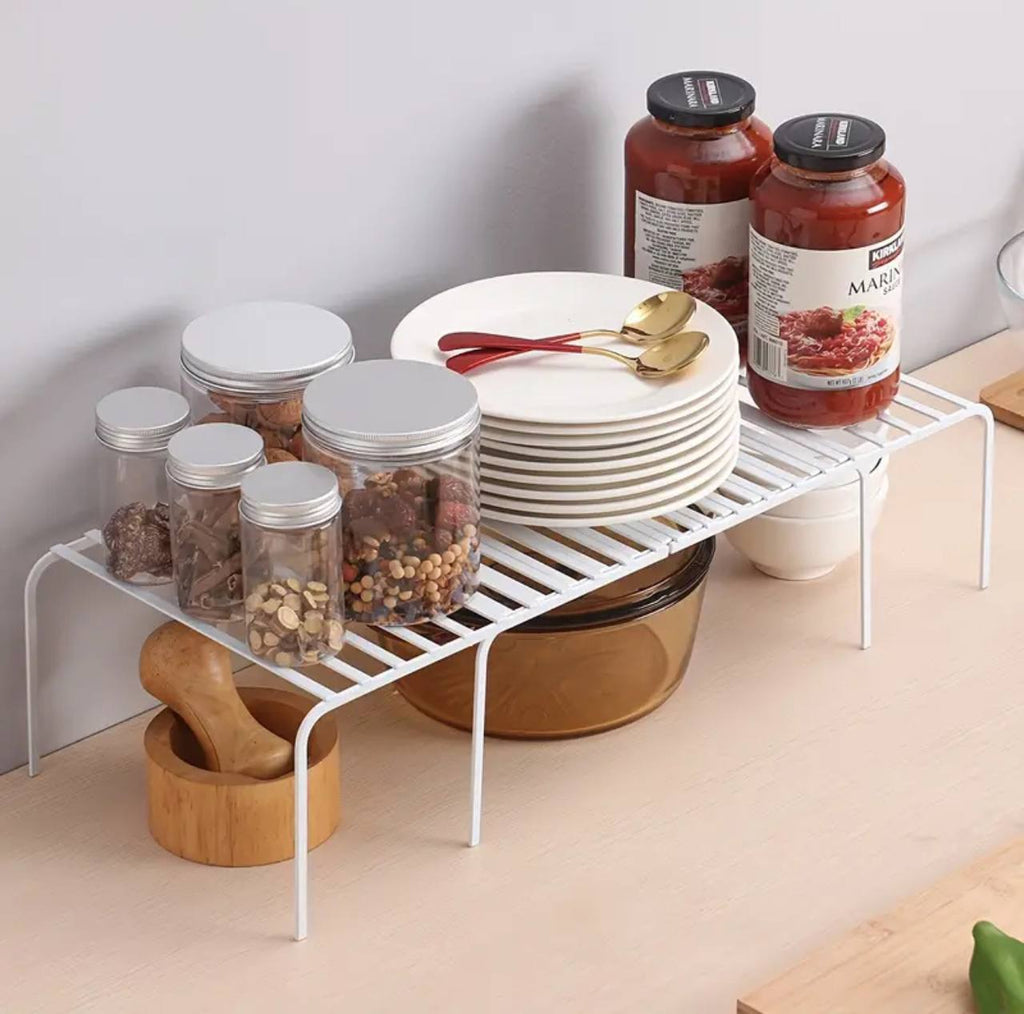 Expandable shelf raiser