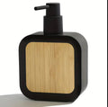 Square plastic soap dispenser with bamboo accent pump.