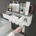 Wall mounting toothpaste dispenser with magnetic cups