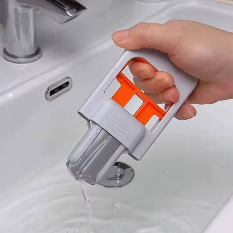 One-hand squeeze handle foldable desktop mop for indoor cleaning.