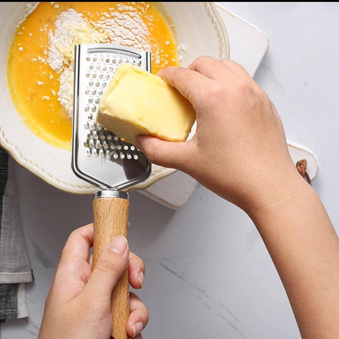 Stainless steel multipurpose grater 
With wooden handle