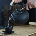 Original heavy duty cast iron tea pot with infuser, cast iron coaster and spoon