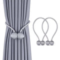 Magnetic tieback curtain holder