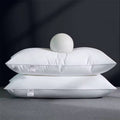 Compressed white comfy pillows.