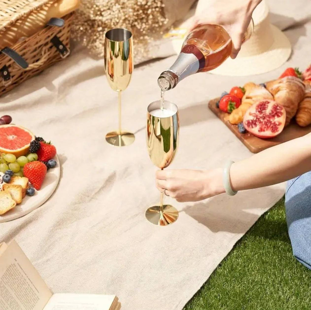 A pair of Gold Stainless steel wine glass